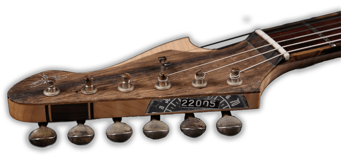 HST Strat style headstock with speedometer inlay.
